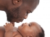Father kisses baby girl