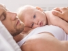 Baby resting on dad's chest