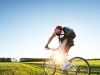 Young man cycling on a rural road