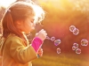 Blowing soap bubbles