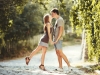 Teen couple kissing at street