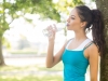 Brunette drinking water