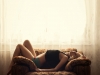 Sexy girl lying on sofa