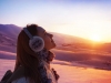 Pretty woman walking in snowy mountains