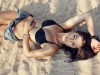 Sexy girl with dark hair on the beach