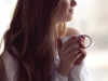 Young woman enjoying morning tea