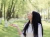 Woman kisses invisible squirrel