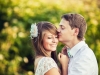 Man tenderly kissing fiancé