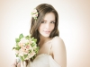 Young beautiful bride with a wedding bouquet