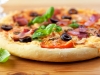 Pizza with ham and tomatoes