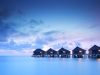 Water villa cottages at sunset
