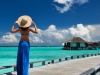 Woman on a tropical beach jetty