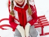 Girl sledding at winter time