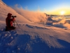 Photographer on snowy mountain
