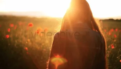 Girl in the wild poppies field