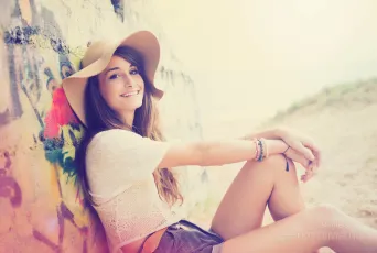 Girl smiles in hat