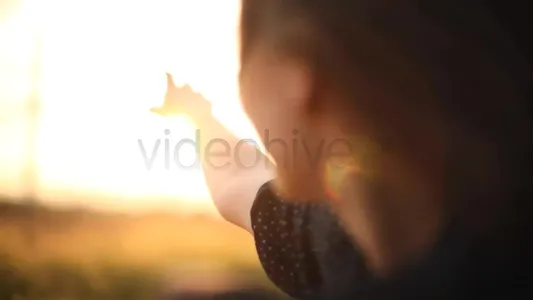 Girl leaning out of car