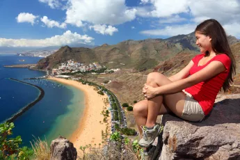 Young traveler looks at the beach view