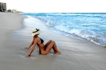 Manuella in black bikini on a Cancun beach, Mexico