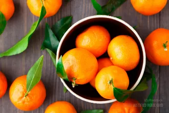 Tangerines on wooden background