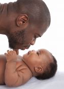 Father kisses baby girl