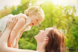 Mother holds daugher