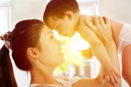 Holding adorable baby