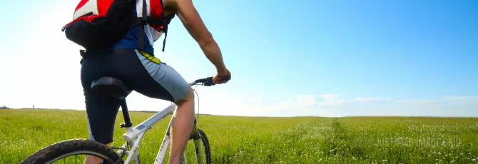 Young man riding on bicycle