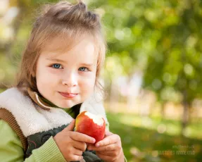 Little girl with apple
