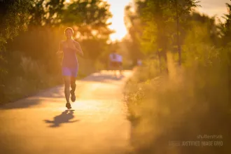 Young woman running outdoors