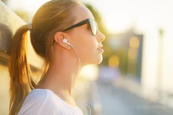 Teenage girl listening to music