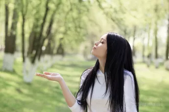 Woman kisses invisible squirrel