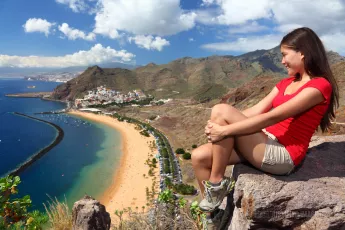 Young traveler looks at the beach view