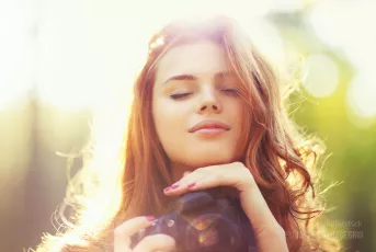 Young woman with camera