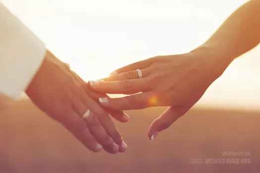 Wedding couple holding hands