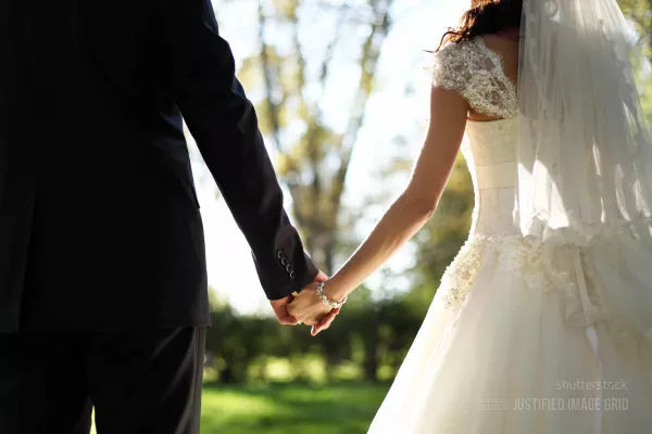 Newlyweds holding hands