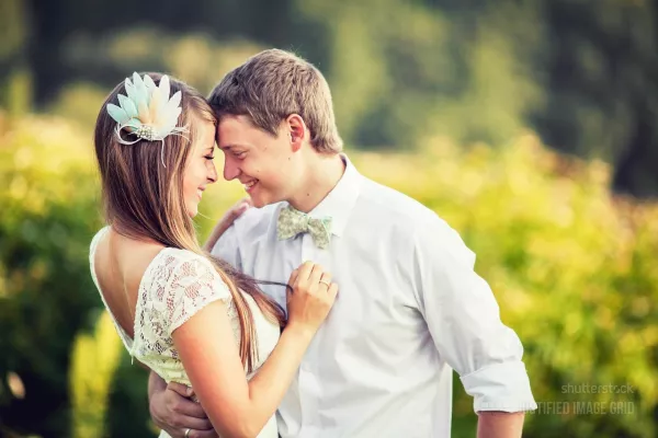 Wedding couple smiling at each other