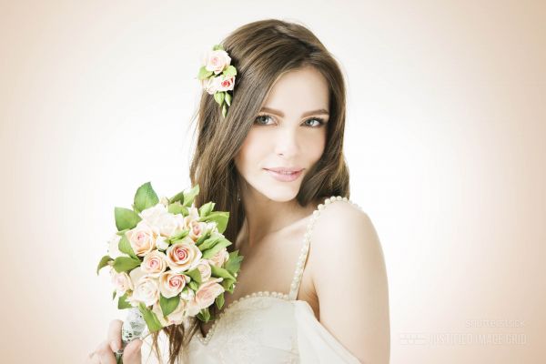 Young beautiful bride with a wedding bouquet