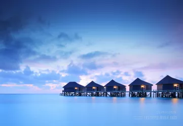 Water villa cottages at sunset
