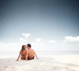 Young happy couple on the beach