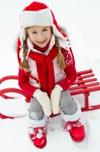 Girl sledding at winter time