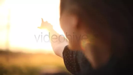 Girl leaning out of car