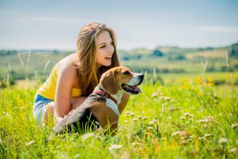 Happy young girl with Beagle