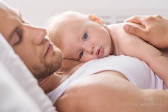 Baby resting on dad's chest