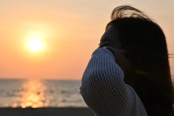 DSC_3474: Watching the sunset, lost in the quiet glow of the sea.
