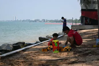 DSC_4824: a man and a boy playing with toys on the beach