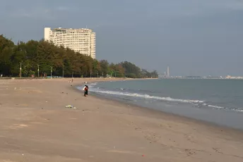 DSC_9603: a person standing on a beach next to the ocean