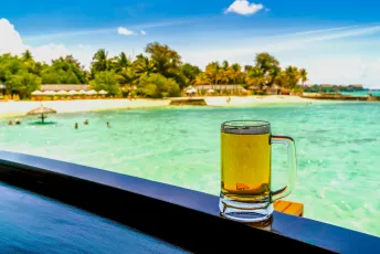 A cool glass of beer overlooking Maldives beach