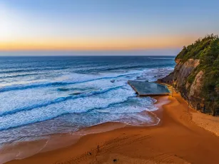 Sunrise at the Seaside with a hazy cloudless sky