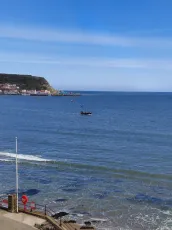 Pirate ship sailing around the south bay Scarborough, North Yorkshire